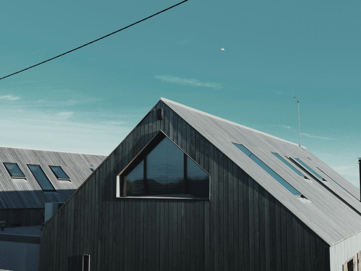 Dark standing-seam metal gable roof