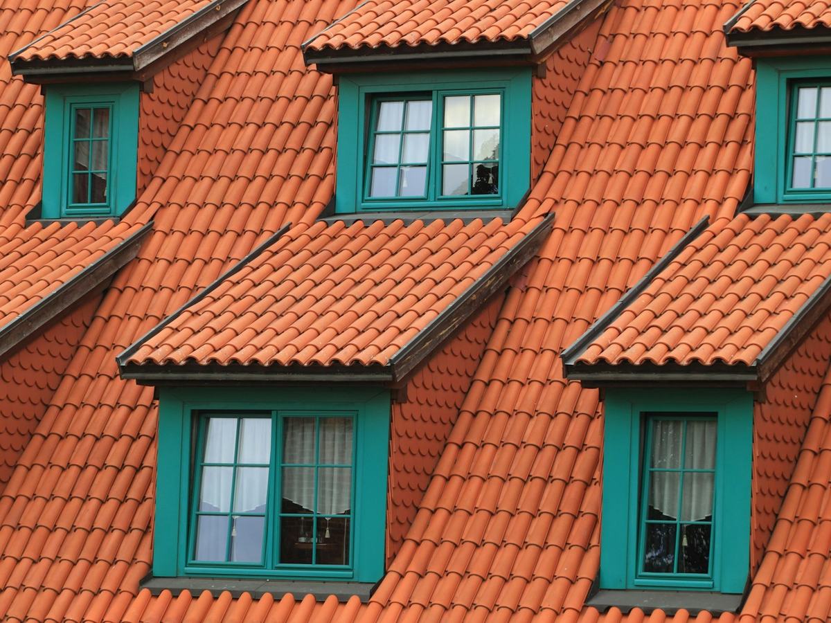 Red clay tile roof with dormers