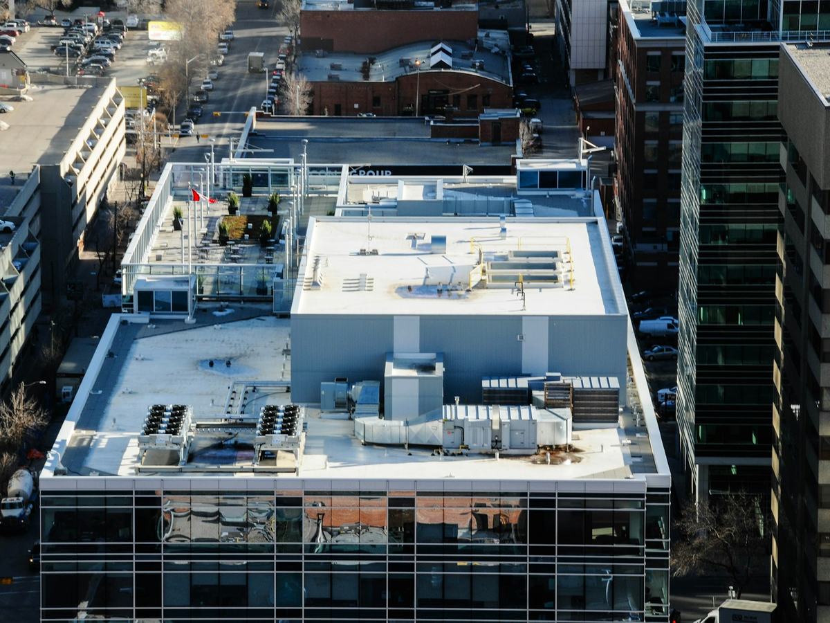 White membrane roof with rooftop units on a commercial building